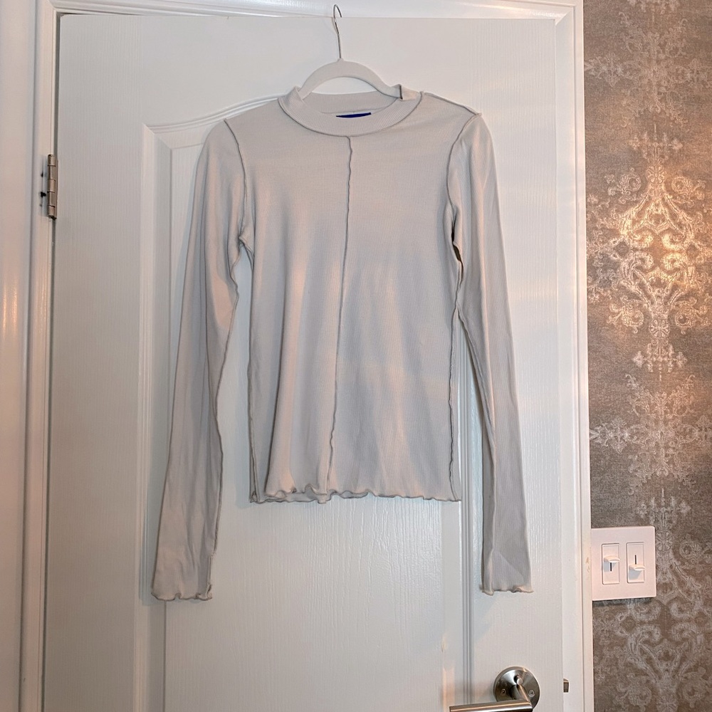 Permanent Vacation long sleeve mock neck cotton top, size XS. With frill hem.